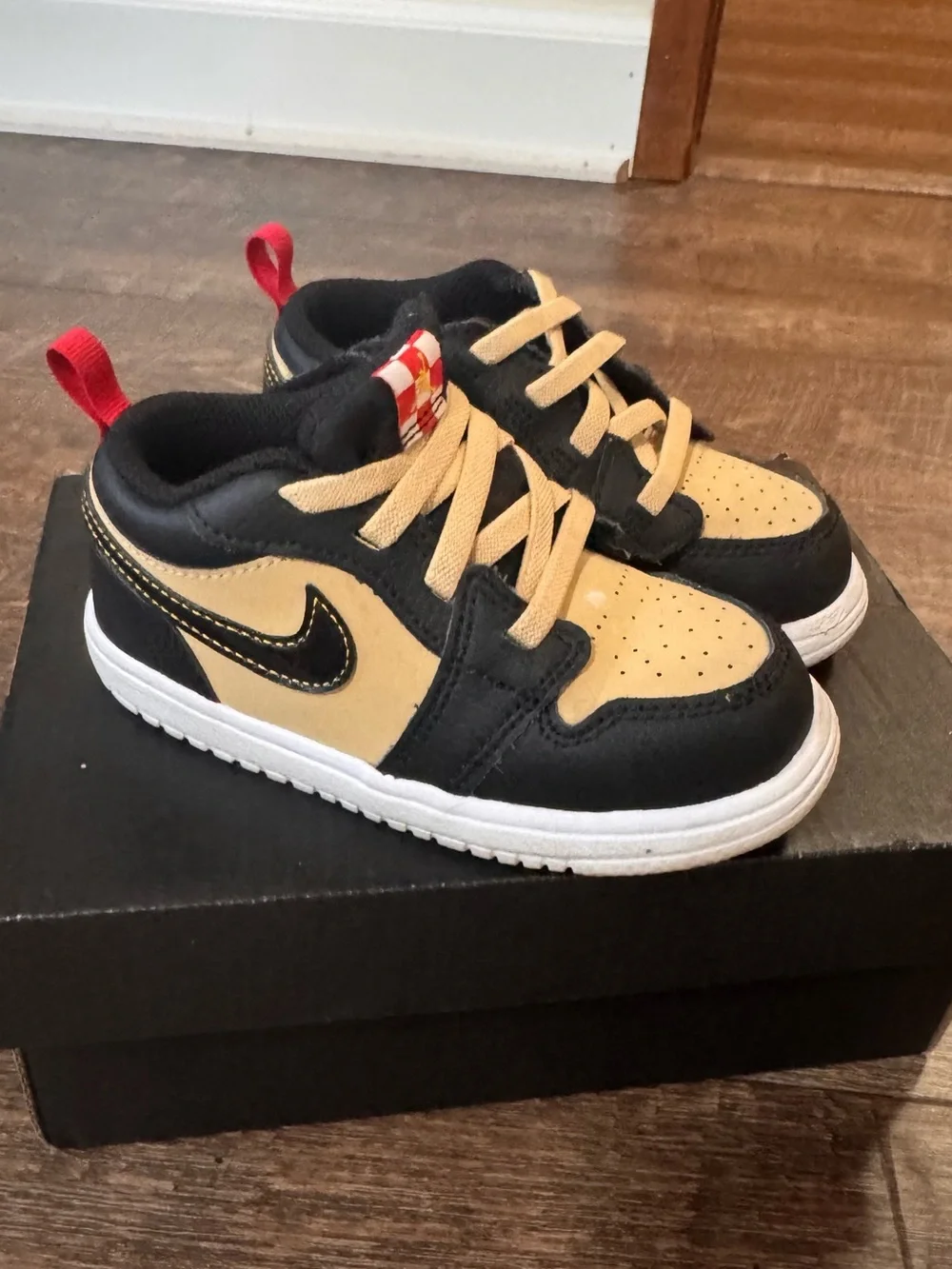 Nike Jordan Toddler Black and Tan Low-Top Sneakers with Red Heel Loop